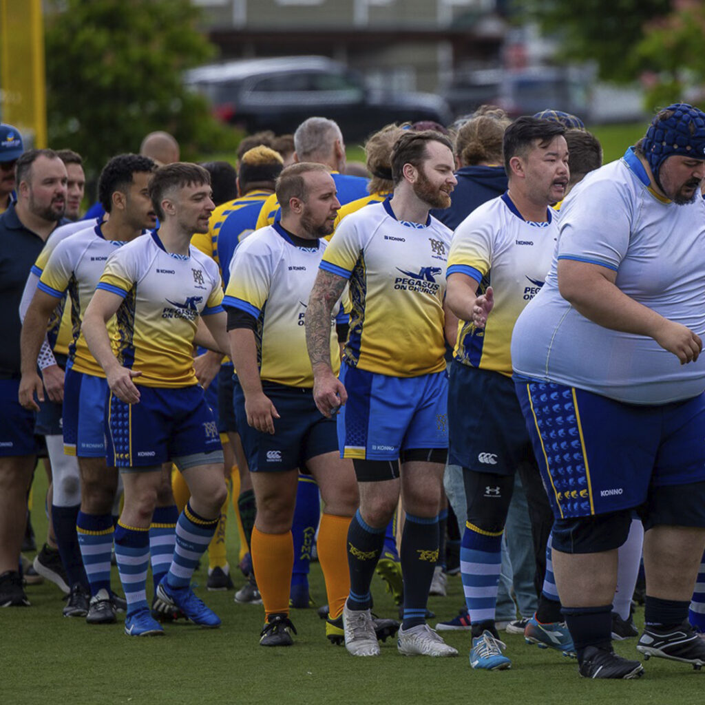 Muddy York Mens+ players shaking hands with the other team at NORAM Cup 2025.