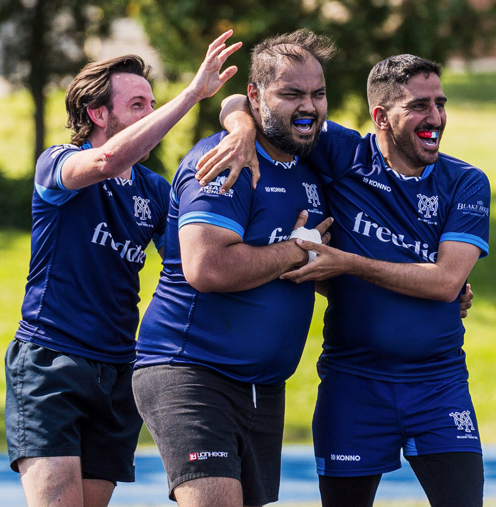 Three Muddy York M+ players celebrating a try.
